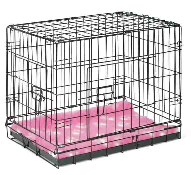 Crate training a puppy with a dog crate with pink vetbed